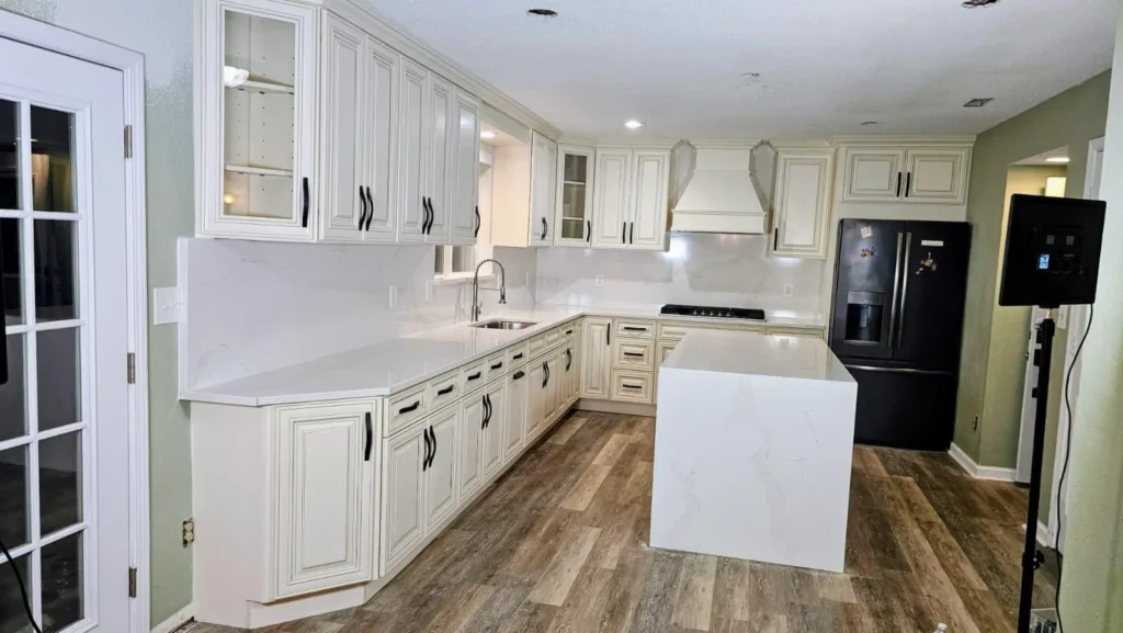 Elegant white kitchen with shaker cabinets, island, and hardwood floors — custom kitchen design and installation in Indianapolis, Indiana by Romero Design